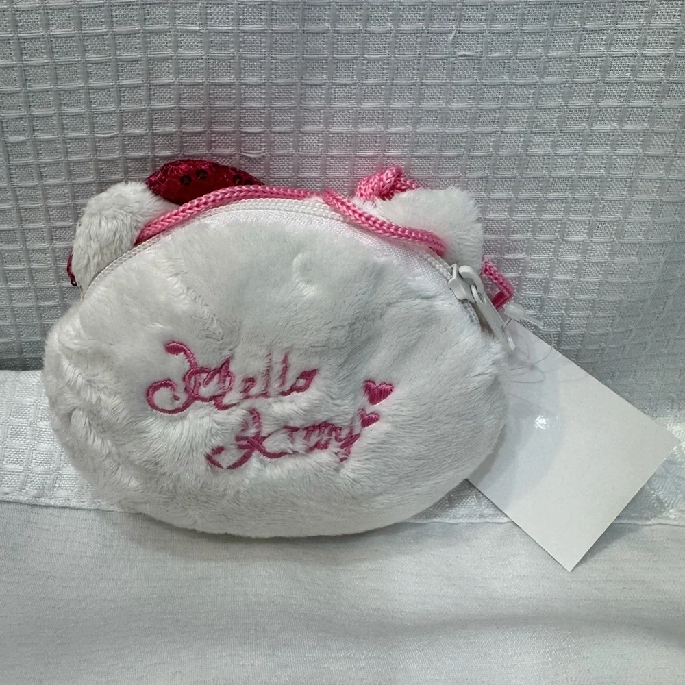 Hello Kitty face shaped bag.  Sequin Bow, White and Pink